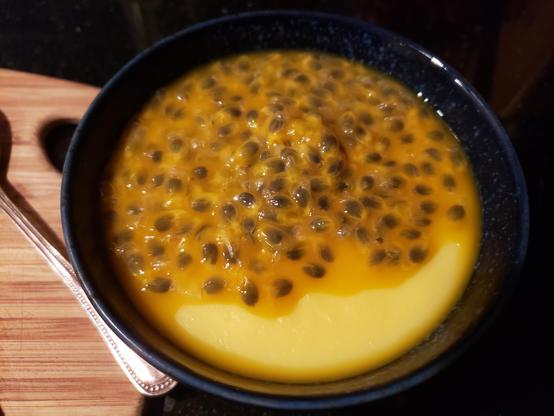 Home made vanilla pudding, topped with fresh pulp and seeds from Passion fruits.