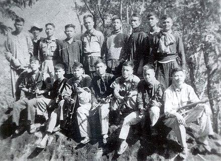 Nguyễn Hữu Thọ and the Phú Yên Province guerrillas prior to the formation of the Viet Cong.
Black and white photo.