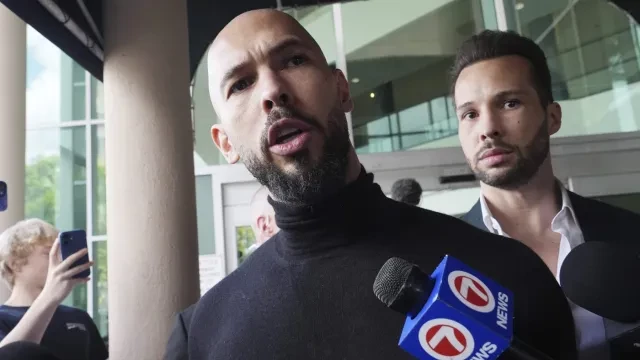 Influencer brothers Andrew and Tristan Tate arrive, Thursday, Feb. 27, 2025, in Fort Lauderdale, Fla. The brothers were charged with human trafficking in Romania and arrived in the U.S. after authorities lifted travel restrictions. (AP Photo/Marta Lavandier)