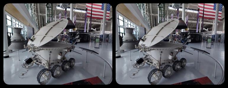 Evergreen Air & Space Museum, McMinnville, Oregon. Unmanned Russian lunar explorer. Looks like a toilet with the lid halfway up. With wheels 

3D, parallel views.