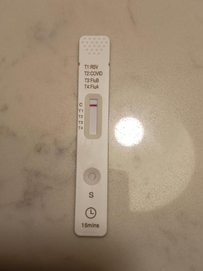 photo of a nasal swap rapid test.  The control bar is red, but the flu and COVID bars are absent