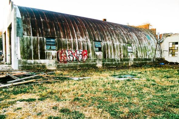 What looks to be a surplus World War II Quonset hut.  Lots of them were sold after the war and many are still in use across the US.  I'm not sure what this one is currently being used for and I didn't want to snoop around since there were a bunch of guys working right across the street.