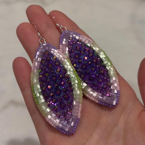 Beadwork earrings in purple, light pink, buttery yellow, and green, with dark purplish blue navette shaped centers