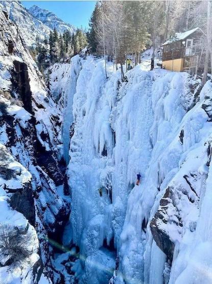 Cabin right by a snowy cliff. Wtf