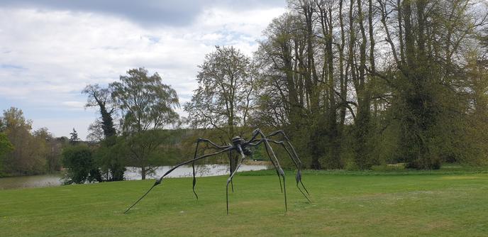 Set beneath a grey sky in a landscape with cut grass, a lake and trees coming into leaf ... a vast bronze cast spider stalks the land.
A Louise Bourgeois sculpture on loan to Compton Verney art gallery, Warwickshire.
