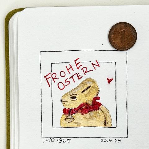 Eine handgezeichnete Illustration eines Hasen mit einem roten Halsband und einer Glocke, darüber der Text "FROHE OSTERN". In der Ecke ist eine kleine Münze als Maßstab angebracht.