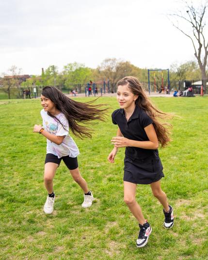 Girls on the Run participants running and smiling