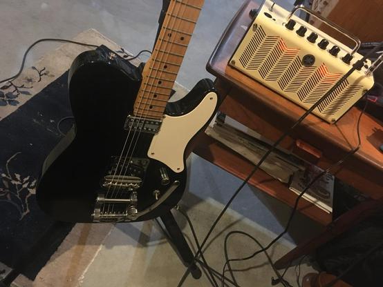 Black Squier Cabronita Telecaster on stand