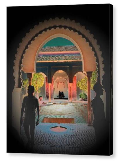 Colour adjusted dark portrait photograph.  In the foreground two figures are silhouetted, behind, through a moorish arch, two other figures sit on a bench.  The image is shown printed upon a box canvas.
