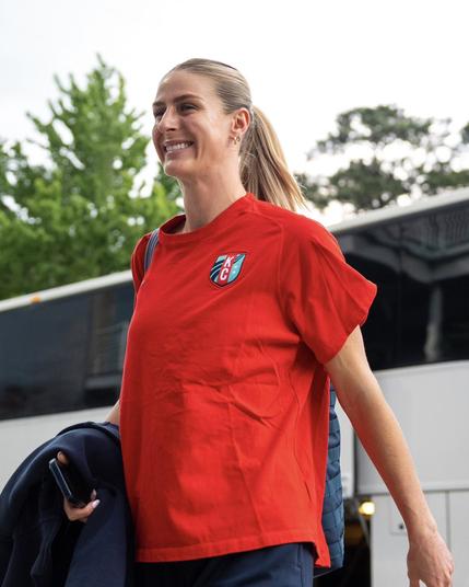 Hopkins smiling as she arrives at WakeMed Soccer Park
