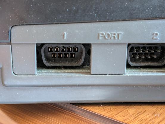Closeup of a controlled port, with most pins broken off.