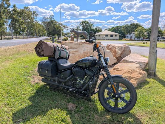 Photo of a black Harley-Davidson parked by the Dingo monument at Dingo QLD.