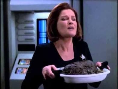 Janeway holding a burnt pot roast