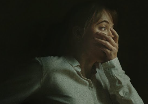 Maika Monroe from the Longlegs marketing still where she's covering a shocked gasp because she has witnessed something awful and horrifying. It's sad the movie just wasn't as great as this image.
