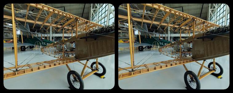 Biplane, no cloth on wings to show wooden structure.