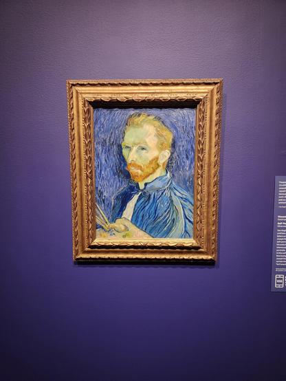 An 1890 self portrait by van Gogh. Here he wears blue, looks left at us, and is in front of a blue background. This painting has significant, bold, deep brush strokes.