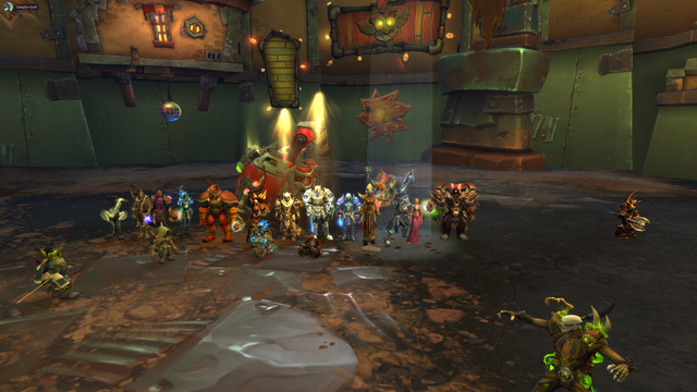 A group of Horde and Alliance players standing beside their kill.