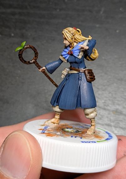 Delicious in Dungeon's Marcille, a generally profusely sweating and blushing elf lady mage, with a staff, ready to unleash sweaty magic at something apologetically. There's no sweat or blush on the model, that's just what she does most of her screen time in the series :D