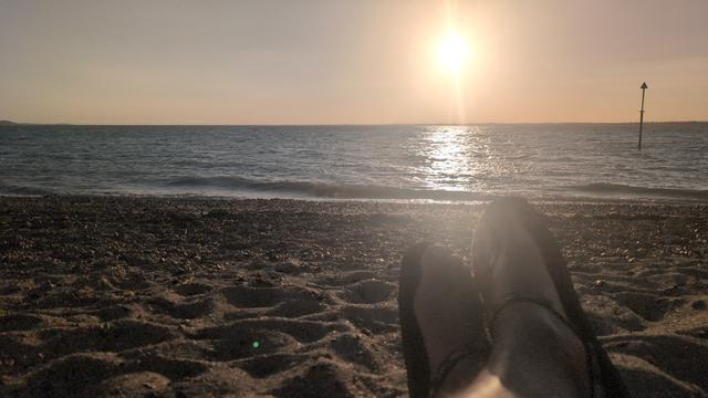 The late, golden, sun reflects off the wind driven waves