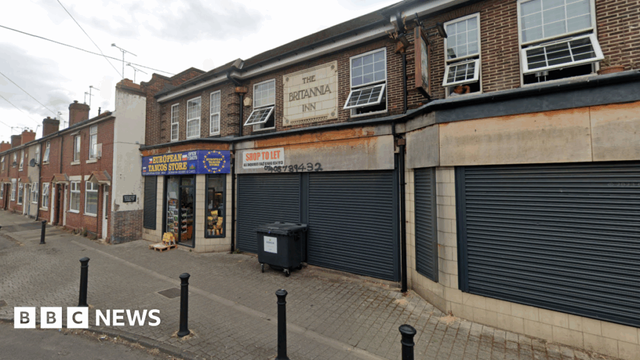 A row of two shops on a residential terraced street in Rotherham