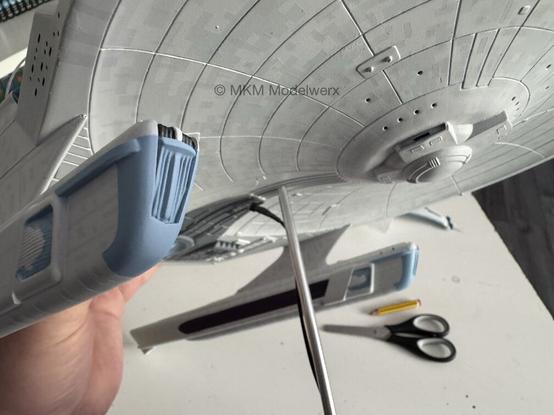 Closeup of one of the front nacelle painted light blue.