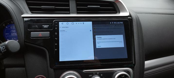 Still image. Same headunit showing wego maps caching all of the united states maps for offline use and a file explorer window:

Internal shared storage > Music >
 
dimitri from paris - a night at the playboy mansion 

dj krush & toshinori kondo - ki-oku 
screamin' jay hawkins - Portrait Of A Man 

Pasting 
05 federico_aubele-tan_dificil.mp3 
1% 
49/3426