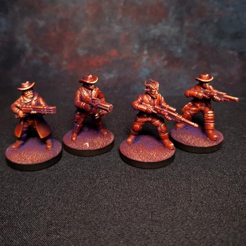 4 painted sci-fi cowboy miniatures against a dark backdrop. Painted in a stylised purple red.