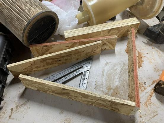 8 sides of OSB cut with two sides getting ready to be stapled