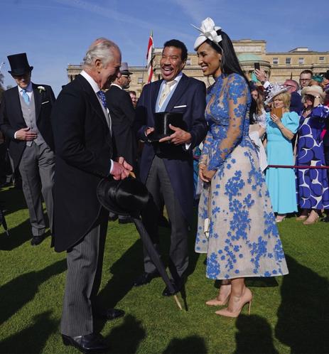 King Charles III with Lionel Richie and Lisa Parigi during a Garden Party at Buckingham Palace, London, in celebration of the coronation. May 3, 2023.