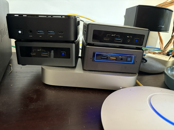4 minipc’s sitting on a Mac mini, running a talos Linux k8s cluster.