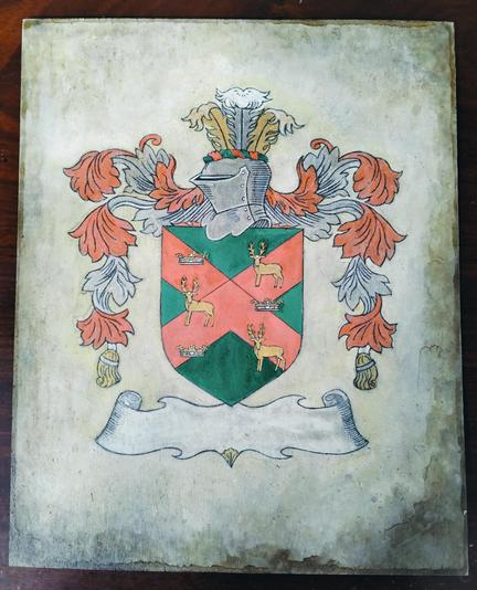 a  crest design, in the center is a green shield with a red 'x' design in the center, 3 crowns and 3 stags on it, there are floral designs coming down on the left and right, a knight's helmet on top, at the bottom is a silver banner , blank