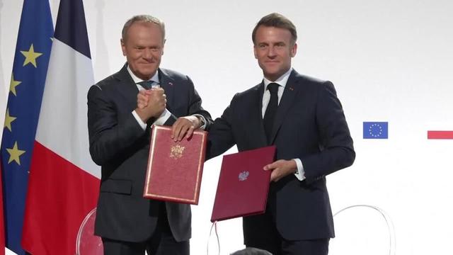 France, Poland sign treaty with mutual defence pledge