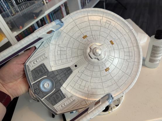The bottom of the saucer with the gridlines washed with black paint.
