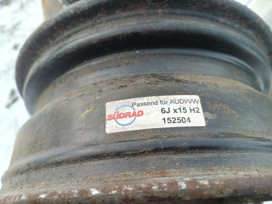 Inside of a steel wheel. The label has a part number and specificiation. They're VAG OEM wheels.