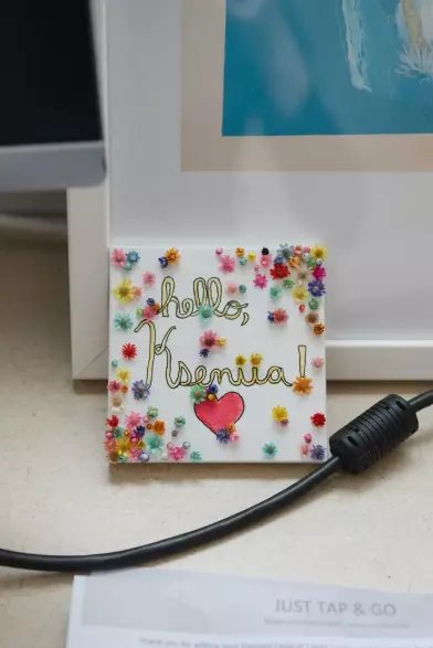 “Any problem I have with data, she has a solution,” a colleague said. A photograph taken from her desk at Harvard showing a cheerful hand-drawn note that says "hello, Kseniia!" decorated with a heart and lots of tiny colorful flowers