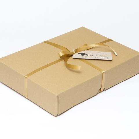 Picture shows a closed A4 box tied with gold ribbon.