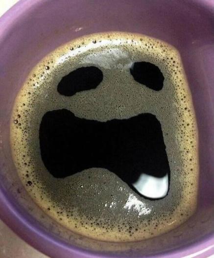 Coffee in cup. Looks like a face.