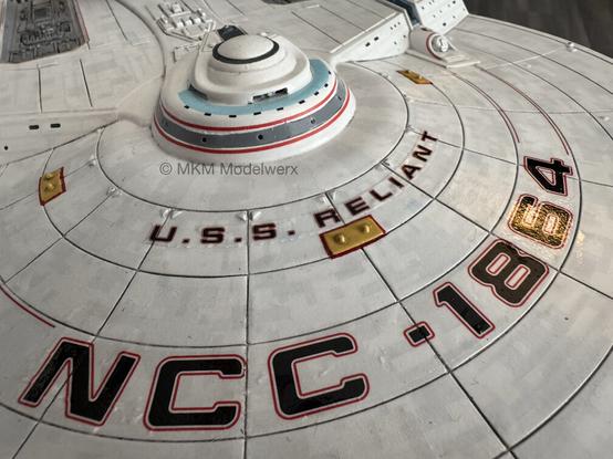 Closeup of the front of the top of the saucer showing the name “U.S.S. RELIANT” decal in place.