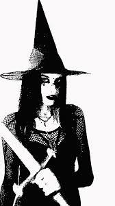 black and white image of a young woman wearing a witch's hat and holding a sword in her left hand, looking into the camera