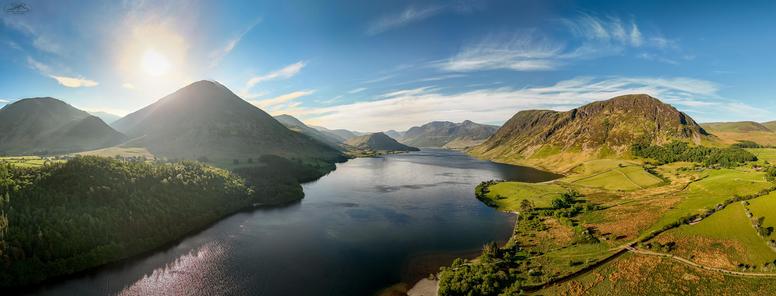 aerial panorama over lake and mountains
