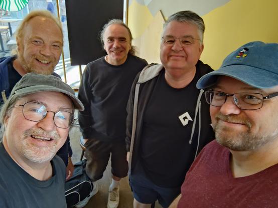 Selfie with five rather worn-out middle aged Devs. All baseball caps, glasses and mainly grey hair! I'm front left.