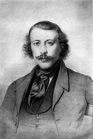 Bakunin looking straight ahead, eye contact, with slightly graying scraggly hair and beard. By Nadar - The New York Public Library [1], Public Domain, https://commons.wikimedia.org/w/index.php?curid=3984624