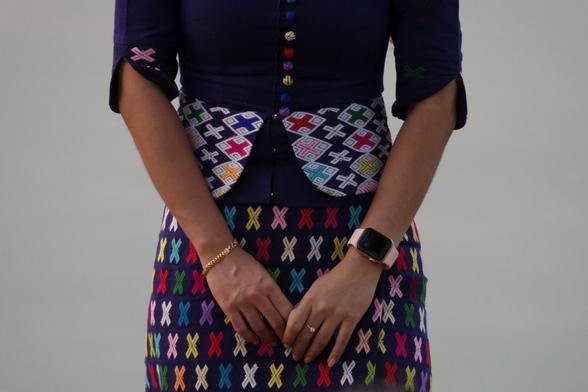 Detail of women's clothing with woven patterns