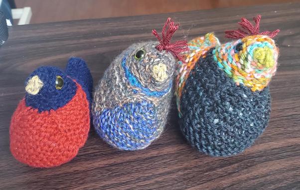 Three little chickies, in different colors, in a line