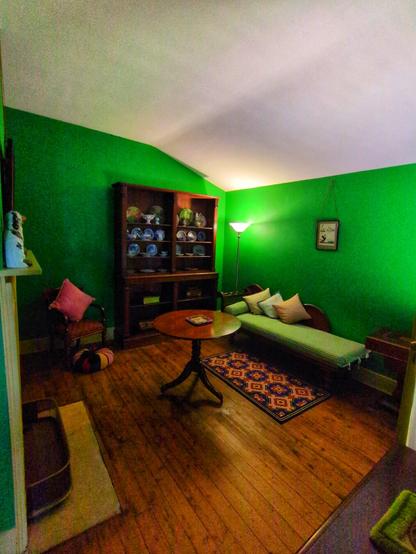 The loungeroom was often used by the ladies, while the men conducted business in the dining room. The walls are painted arsenic green, and were originally painted with a paint that contained arsenic.