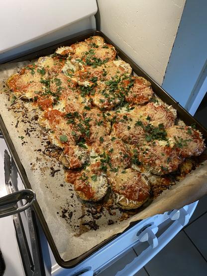 Slices of eggplant baked with marinara, Parmesan cheese, and mozzarella.