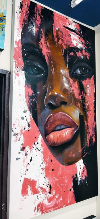 a painting of a young african person's face, there are streaks of pink coming down, black too, she is looking at the viewer, her face seen from the front in a three quarter view
