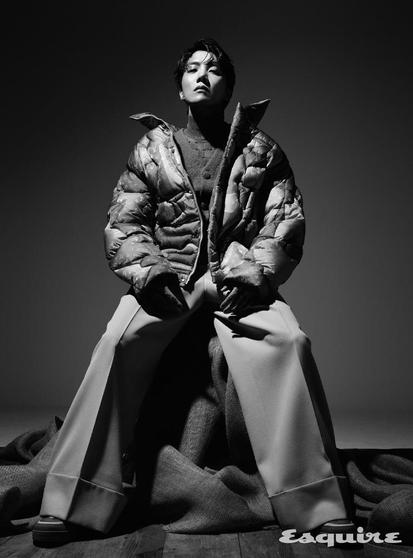 Fashion Hobi in black and white in Esquire Korea for Louis Vuitton. He's wearing a puffy bomber jacket, wide leg pants, gloves, swoon.