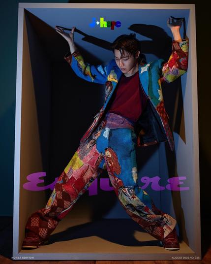 Fashion Hobi in Esquire Korea for Louis Vuitton. Posing in a box (ala Jack in the BOx), wearing a colour art print suit.