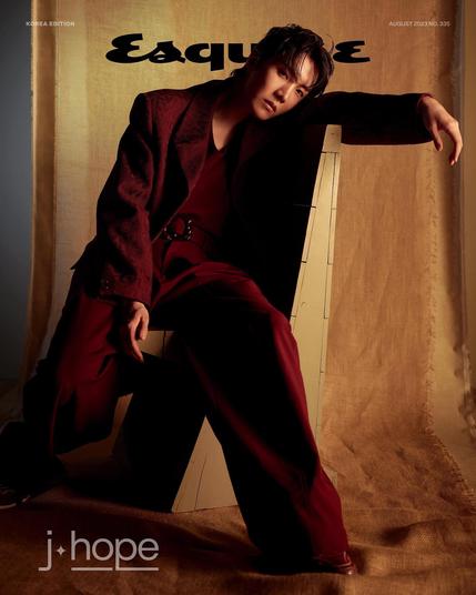 Fashion Hobi in Esquire Korea for Louis Vuitton. Seated, burgundy suit.